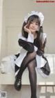 Coser @ 桜 井 宁宁 Vol.030: 双 马尾 黑丝 女仆 (62 photos) P5 No.73f044 Image No. 115